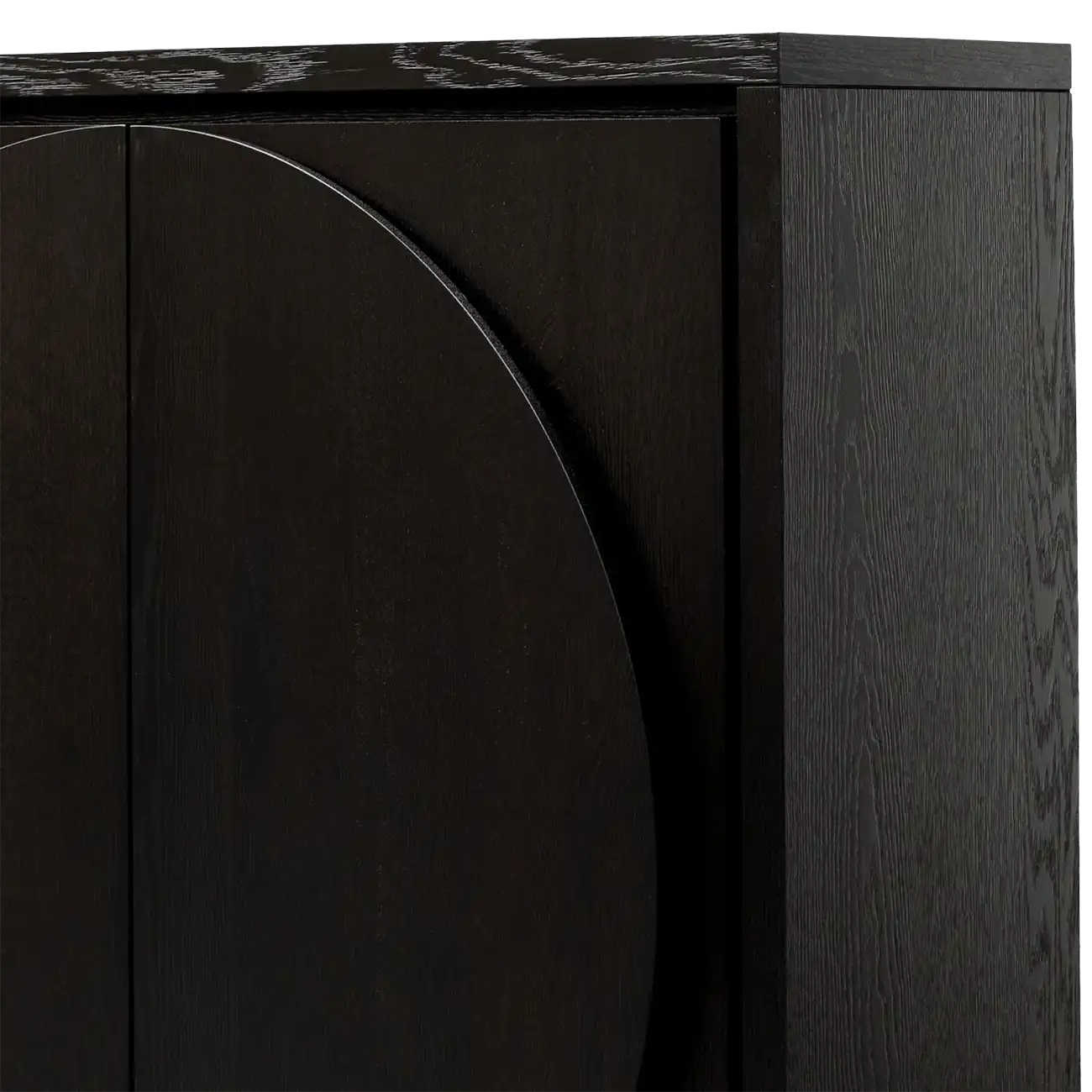 Close-up of a dark wood cabinet with a curved front detail and a dark marble-look top edge.